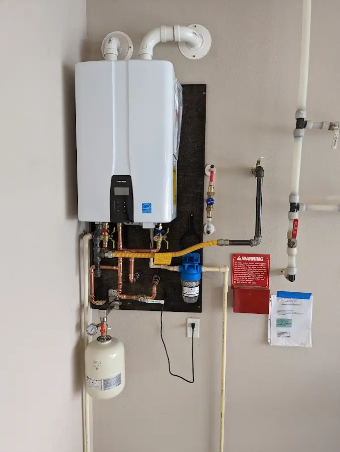 Professional plumber installing copper piping in a Damascus home